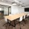 conference room with a large, wooden table and modern decor