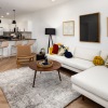 modern living room furniture with kitchen area beyond