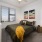 bedroom with a large window and modern decor