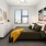 bedroom with modern spaces and a large window